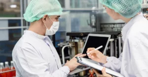Two people conducting a view for ISO 22000 standards