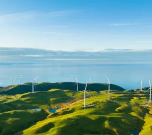 mountains with windmills with the ocean in distance